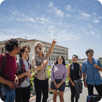 A teacher leads prospective students on a campus tour that was scheduled through YouCanBook.me.